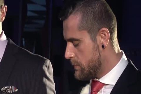 Two guys In Suits Meet In A Bar